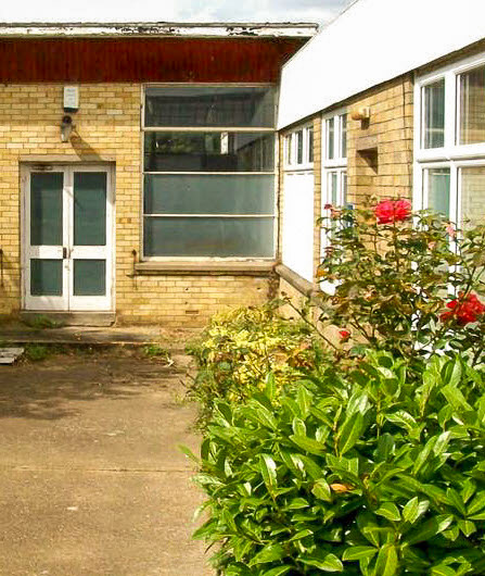 2025 Cropped as 1963 image. David Newman comments "A photo that I took today of Goldhanger Fruit Farms' canteen block, to match the 1963 photo. It seems unused and pretty derelict, but surrounded by modern well-used industrial buildings and is a busy place". (Courtesy David Newman)