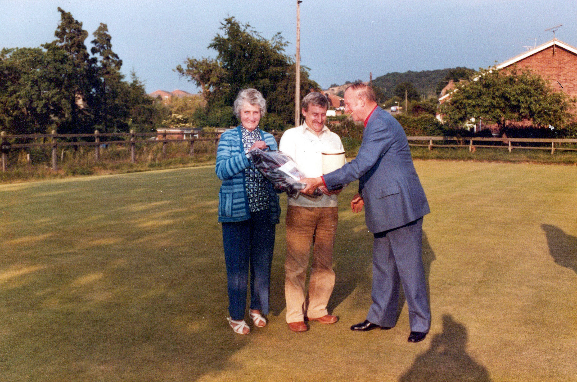 1980's Minsterley Bowling Club. Marion Davies identifies Dave and Rose Davies. Phoebe Spragg adds "Dave Nicholas in the middle". (Courtesy Joe Lyons)