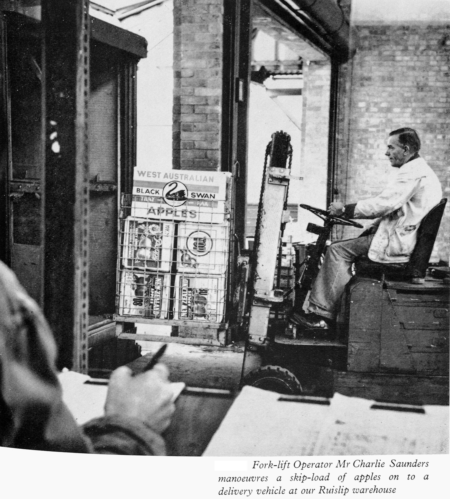 1962 Feature article about fruit and vegetable sales pictures fork-lift operator Mr Carlie Saunders at Ruislip warehouse. (Express News Autumn)