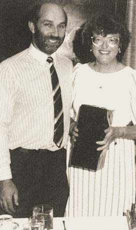 1989 Mary Sutton retires after 36 years from Exeter Dairy, receiving award from Phil Howe (wrongly captioned on original), Processing Manager
