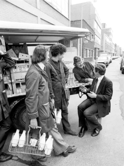 1975 Bishopsgate Depot. "Colin Wills with milkmen from Clifton Street depot of Express Dairy". Noel Keady identifies "110 Clifton Street, London EC2A 4HT. Depot No 11/2/508, District 7." (Courtesy mediastorehouse.com)