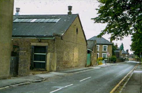1980 Neville and Griffin Dairy was founded by William Neville in 1857 and was bought by E.Griffin in 1899. "The OS map for 1876 shows a smaller building occupying the site and this appears to have subsequently expanded by taking over part of the rear gardens of 37 and 39 Church Street. The dairy was closed down by this time and awaiting demolition. By 1994 the OS map shows that the whole area between Church Street and Victoria Street had been redeveloped as housing." (Courtesy Reg Harrison Collection, Slough Library)