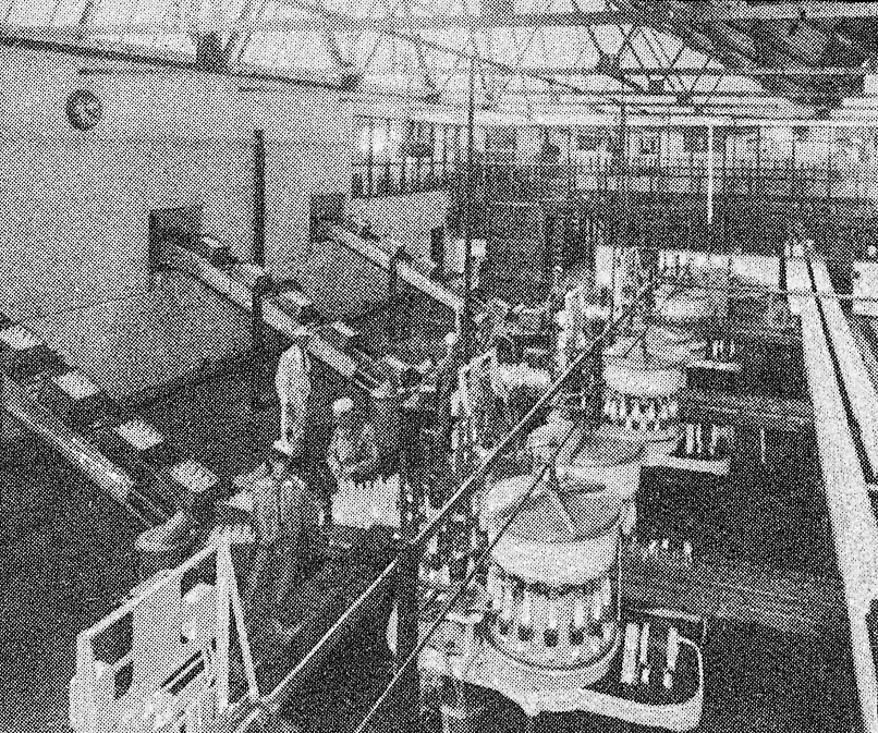 1930's Cricklewood-Bottle Filling Hall. 'A peep behind the scenes of the Express Dairy, Claremont Road, Cricklewood - The largest dairy in Great Britain' (From 'While London Sleeps' booklet.