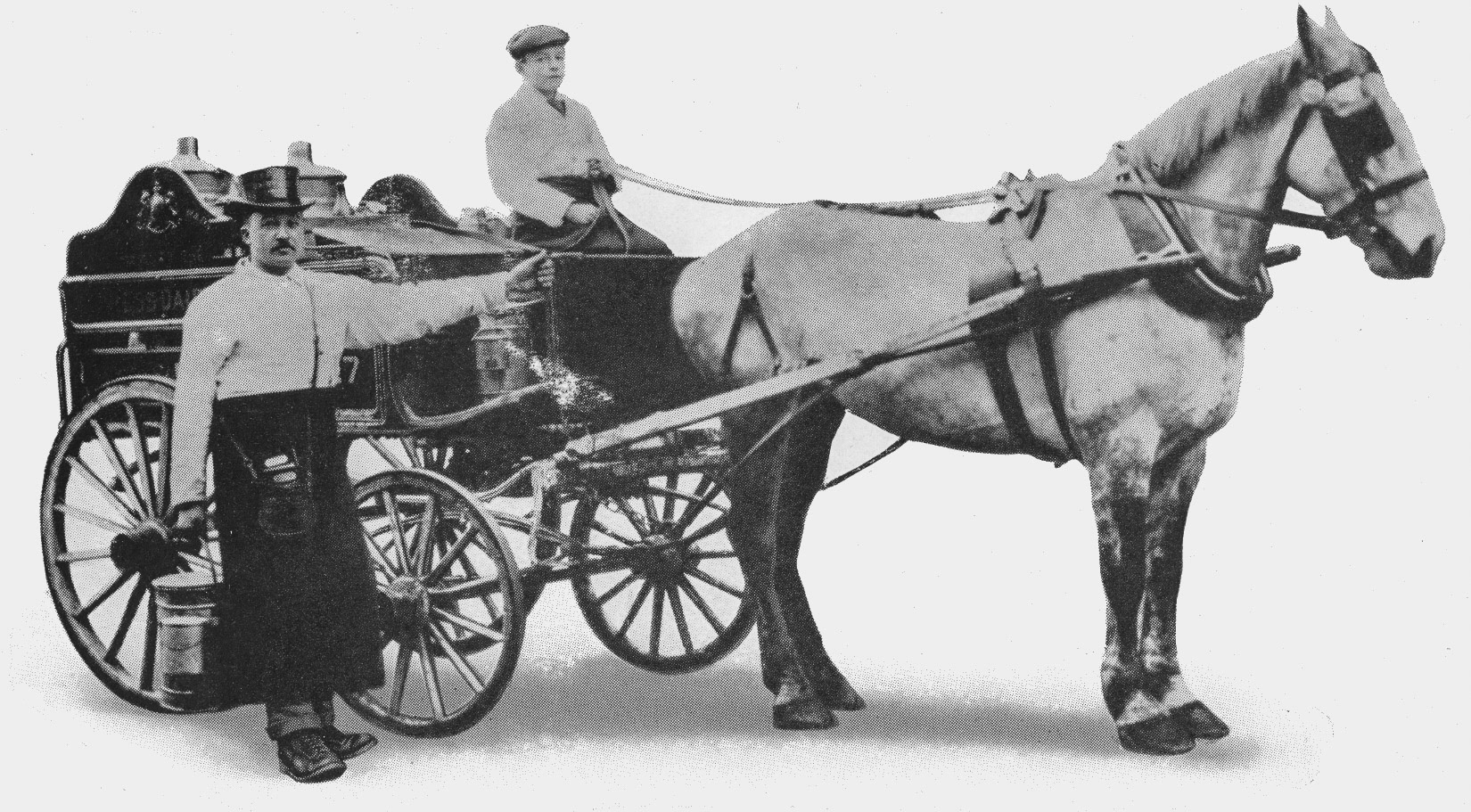 1902 The roundsman's traditional top hat wasn't changed to a peaked cap until 1902, but the Express trademark steam locomotive logo and blue and white livery remained unchanged. (From Express Story 1864 - 1964)