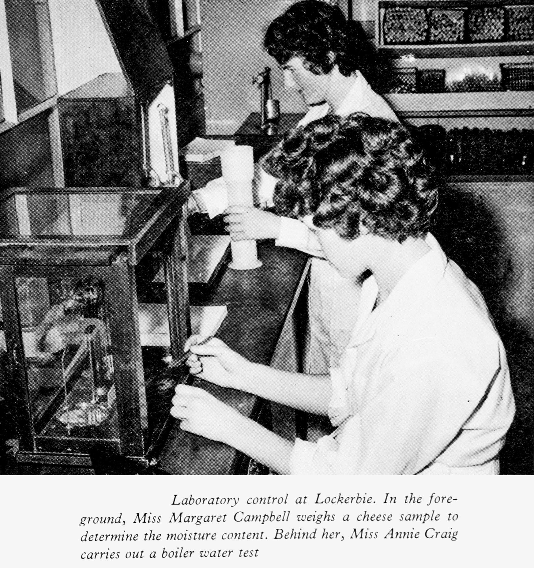 1961 Lockerbie Laboratory with Miss Margaret Campbell weighing a cheese sample and Miss Annie Craig carrying out a boiler water test. George Trudt comments "I know Margaret Campbell. Margaret Hunter (after marriage) lived opposite my Mum and Dad for a good number of years. She and her late Husband Jimmy became good friends as neighbours. It was Jimmy that encouraged my Dad to apply for a the Boiler Plant Attendants job at Priestdykes. She remarried and went to live in Australia for a few years before returning to Lockerbie." (Express News Autumn)