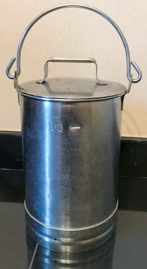 1 Gallon milk can., from David Eyer's collection of Express memorabilia, from his daughter. Angela comments "My father used to work for Express Dairy, he drove one of the artic lorries at Cricklewood. His driving skills were amazing, how he reversed into some of the small milk depots is beyond me. Maybe his driving skill was down to his time served in the National Service in Egypt where he drove in convoys. I remember him telling me about of some of the farm collections and depots-Muswell Hill, Hampstead, College Farm (my sister worked at the weekend in the café for a while) Barnet, Homestead Farm Welwyn Garden City, Royal Parks and many more. When he was working it would be 6 days a week early start and late finish, and I think it was on a rota so it meant that he would have to work on a Sunday." (Courtesy Angela Eyers)