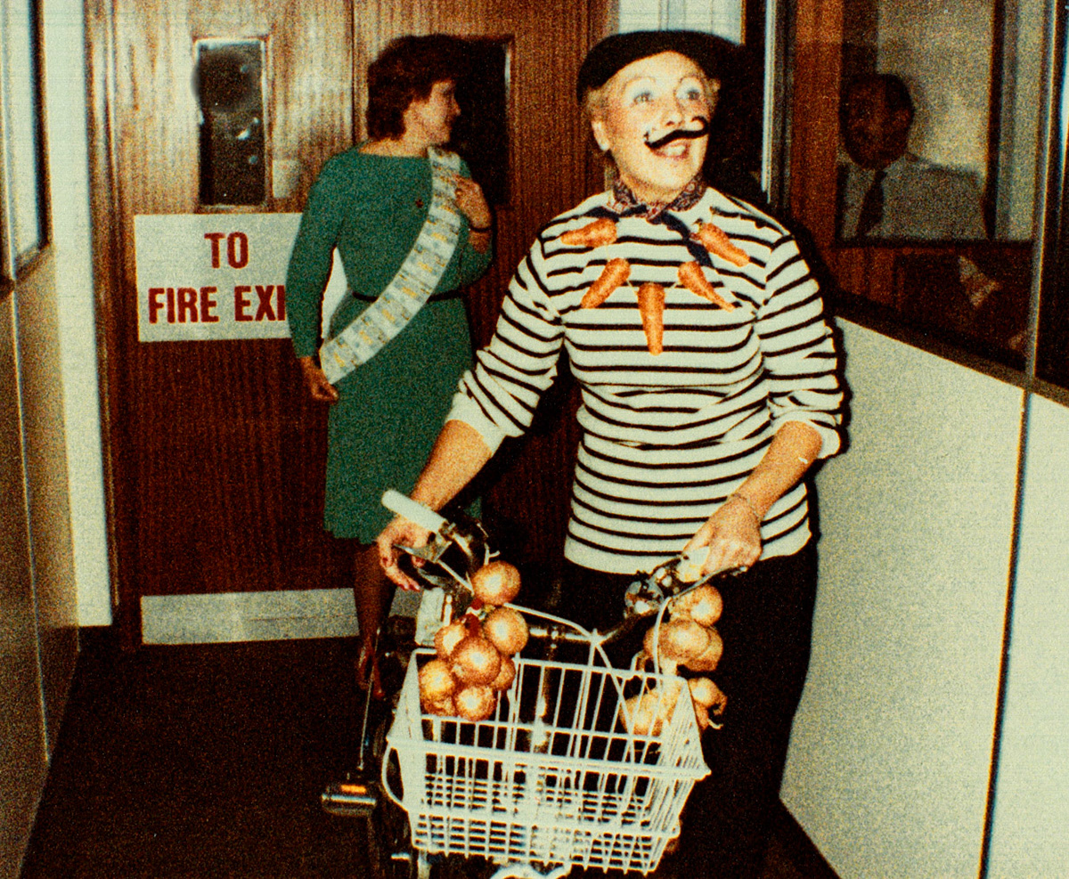 1983 November - Milk Division trip to Boulogne. Beryl Pursove explaining the Express Sash to Don Kirby (Courtesy Beryl Purslove)