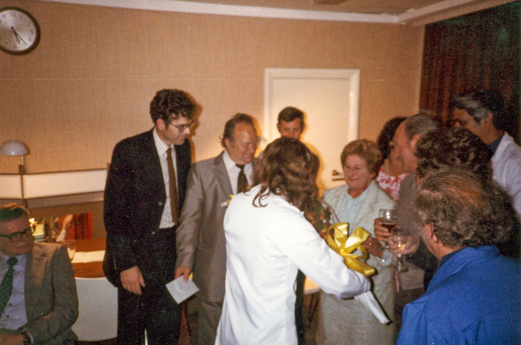 1980's Bridget Nash presents bouquet to Ron Trudell's wife, with Dennis Watson looking on.  Eddie Barnes seated, Dave Gambriel, Reg Noquet and Ralph Emerson in the background, partly hidden.
