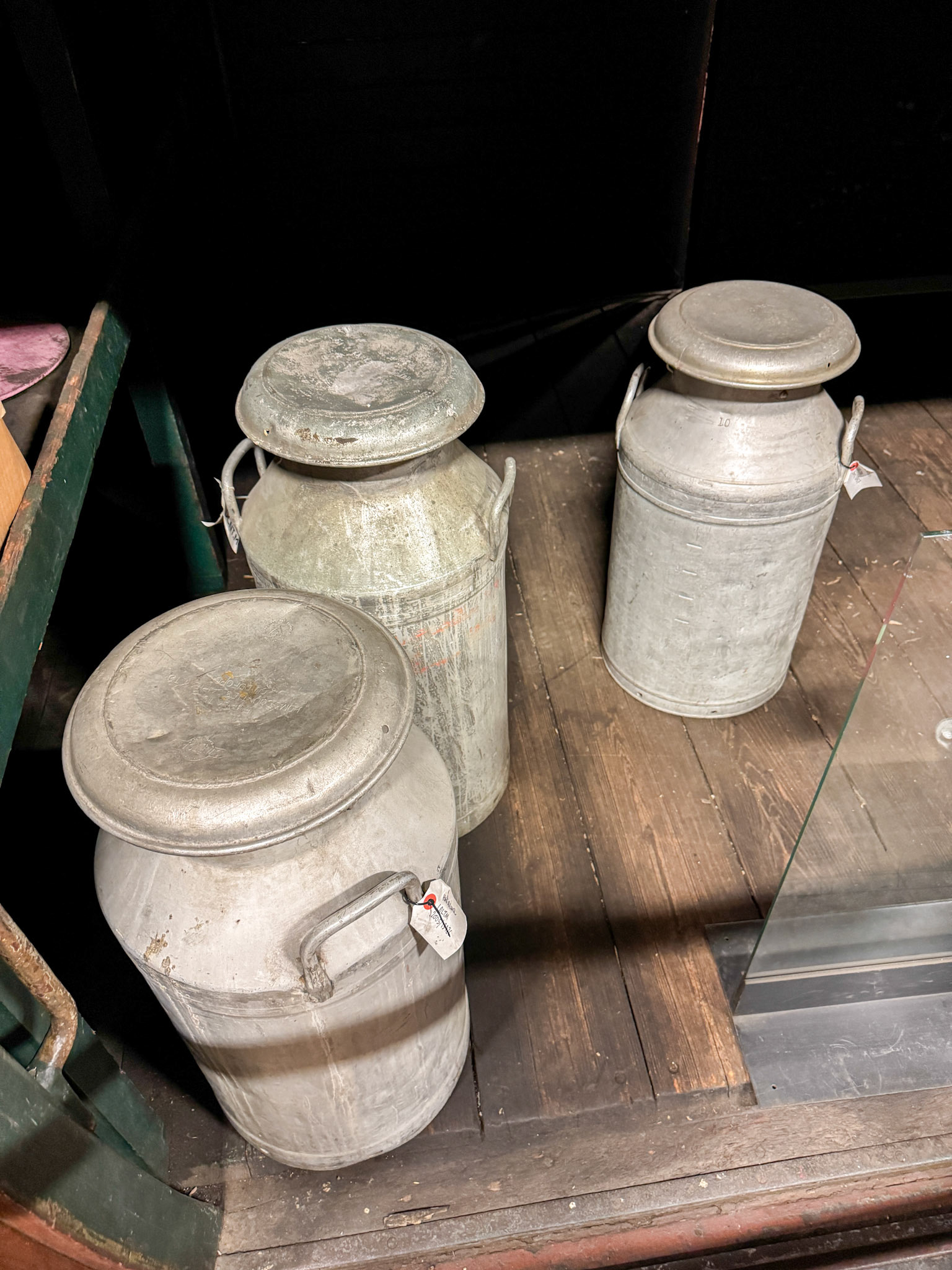 1896 Metropolitan Railway Milk Van No. 3, photographed at the London Transport Museum Depot, Bollo Lane, Acton in April 2025. "This milk van formed part of the steam trains running on the Metropolitan Railway and was used to transport milk into London from farms in Hertfordshire and Buckinghamshire. It sported wood panelling and the hand-painted Metropolitan Railway coat of arms. The car was ventilated to keep the milk fresh and the suspension was modified to prevent it from turning to butter during the journey. The milk van demonstrates the engineering solutions required even for seemingly simple tasks." Accession: 1981/540. Express Dairy Tales collection.
