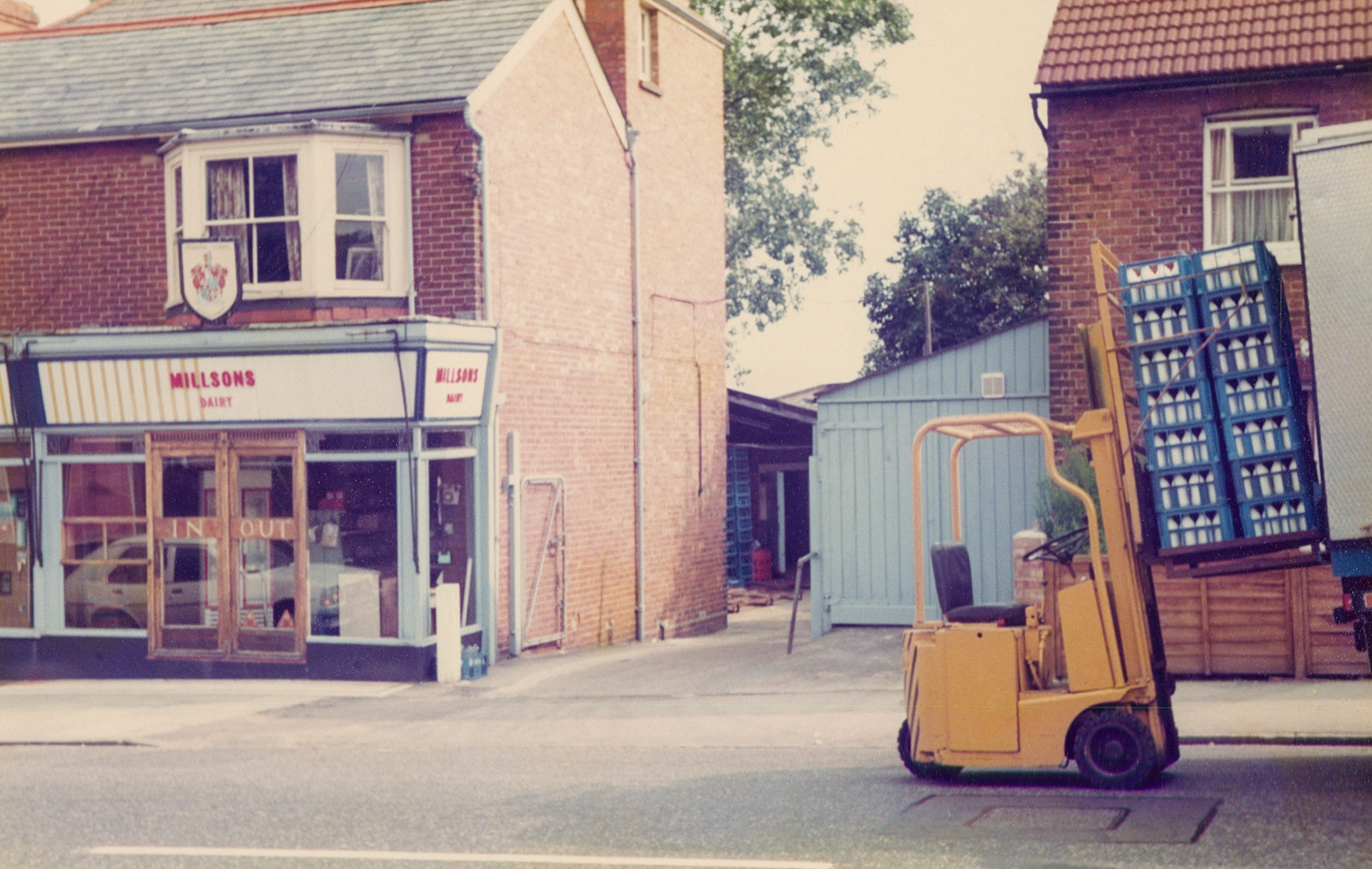 1980s Millsons Dairy, Pembury Road, Tonbridge. Robin Fraser Bell comments "I used to deliver there from Welling depot, back of a 7.5 ton back in mid 90s.. two lifts every other day. I think they had 3 rounds, used to reverse in the driveway and boy was that slope bumpy! We used 'ears' to attach to the fork lift to help stop the load rocking off the forks. " David Rye adds "I live a few doors down, now converted to flats and a small dwelling built out the back, seen a few bottles smashed on unloading." (Picture by Reg Ball, on loan from Colin Bristow)