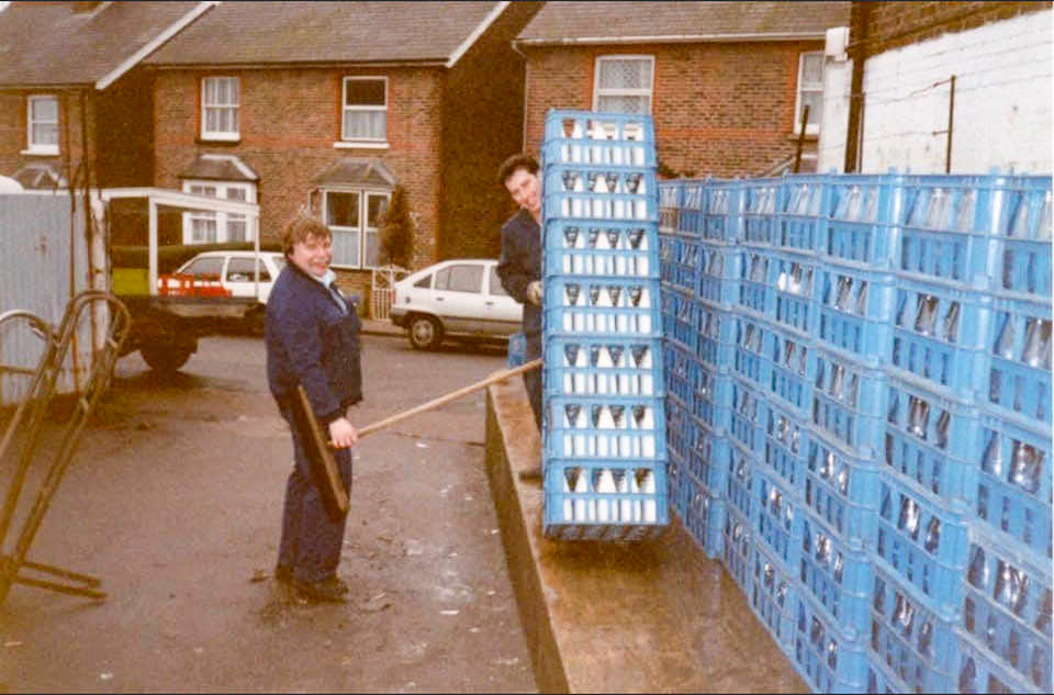 1990's East Grinstead Dairies yard in Dormans Park Road. Richard Evans identifies Kevin Kilduff on the right, and mentioned that there were depots at Clockhouse, Lindfield, Stonehouse, Crowhurstlands, Wasp Green, Sheffield Park, and East Grinstead. (Courtesy Richard Evans)
