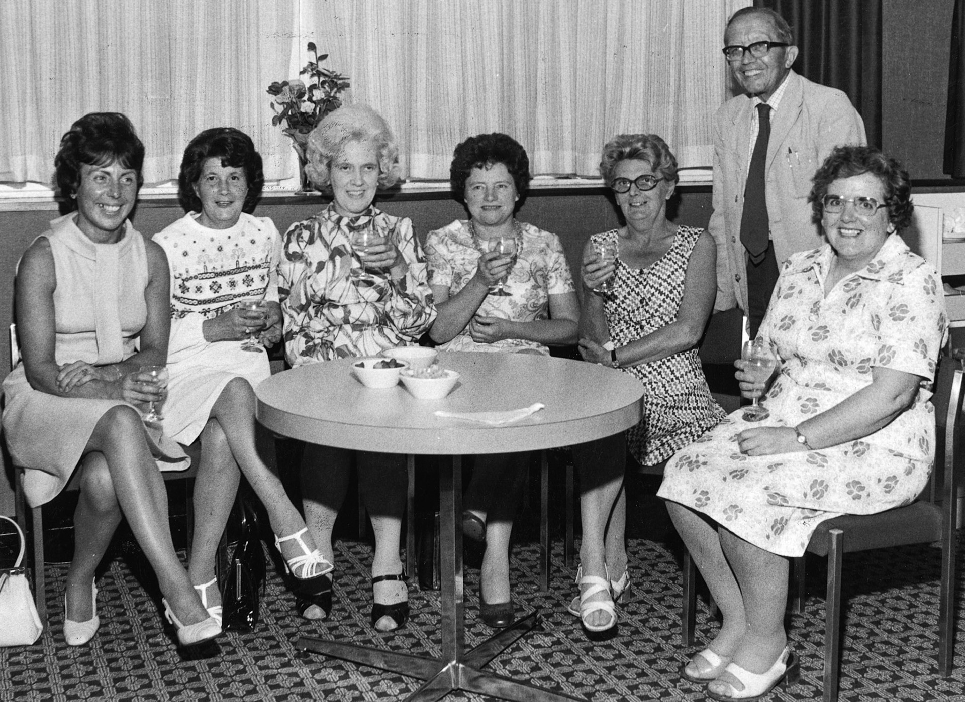 1983 Audit Department. Beryl Purslove comments "From left to right: me, Jean Smith, Mable Walton, Mary Powel, Mary Gomm, and Olive Clifton. John Oliver Chief internal Auditor, standing. Sadly all bar me are up in the dairy in the sky." (Courtesy Beryl Purslove)