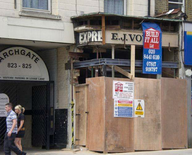 2008 Express shop at 825 High Road, North Finchley undergoing shopfitting on 15 June when the fascia of two previous businesses were uncovered. Malcolm comments "The Express Dairy was there in 1970 and by 1980 E J Voyce, a fruiterer, had taken over." (Courtesy Malcolm MCcarthy)