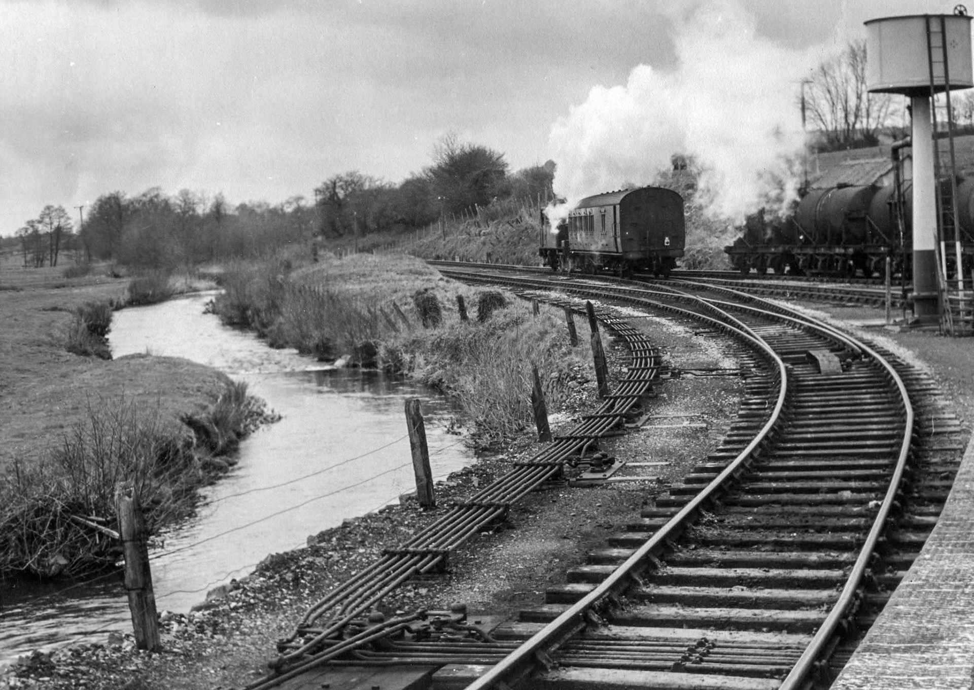 1950s? Hemyock, Devon-"View from the platform, showing how close the track was to the river." Express only did egg packing at Hemyock, the dairy later became St Ivel. (Courtesy Discovering Devon, Somerset and beyond FB)
