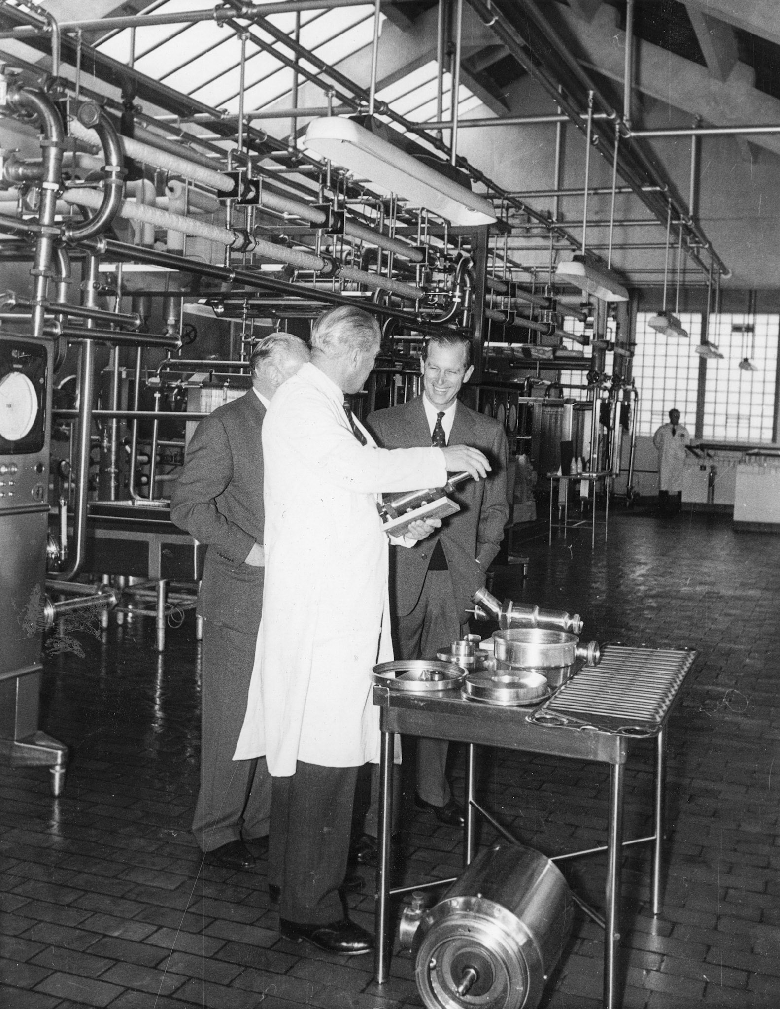 1957 South Morden-Duke of Edinburgh's visit on November 12-Mr T.D, Potter Processing Director explains the operation of an automatic valve to the Duke, with Walter Nell looking on (Courtesy Paul Luke)