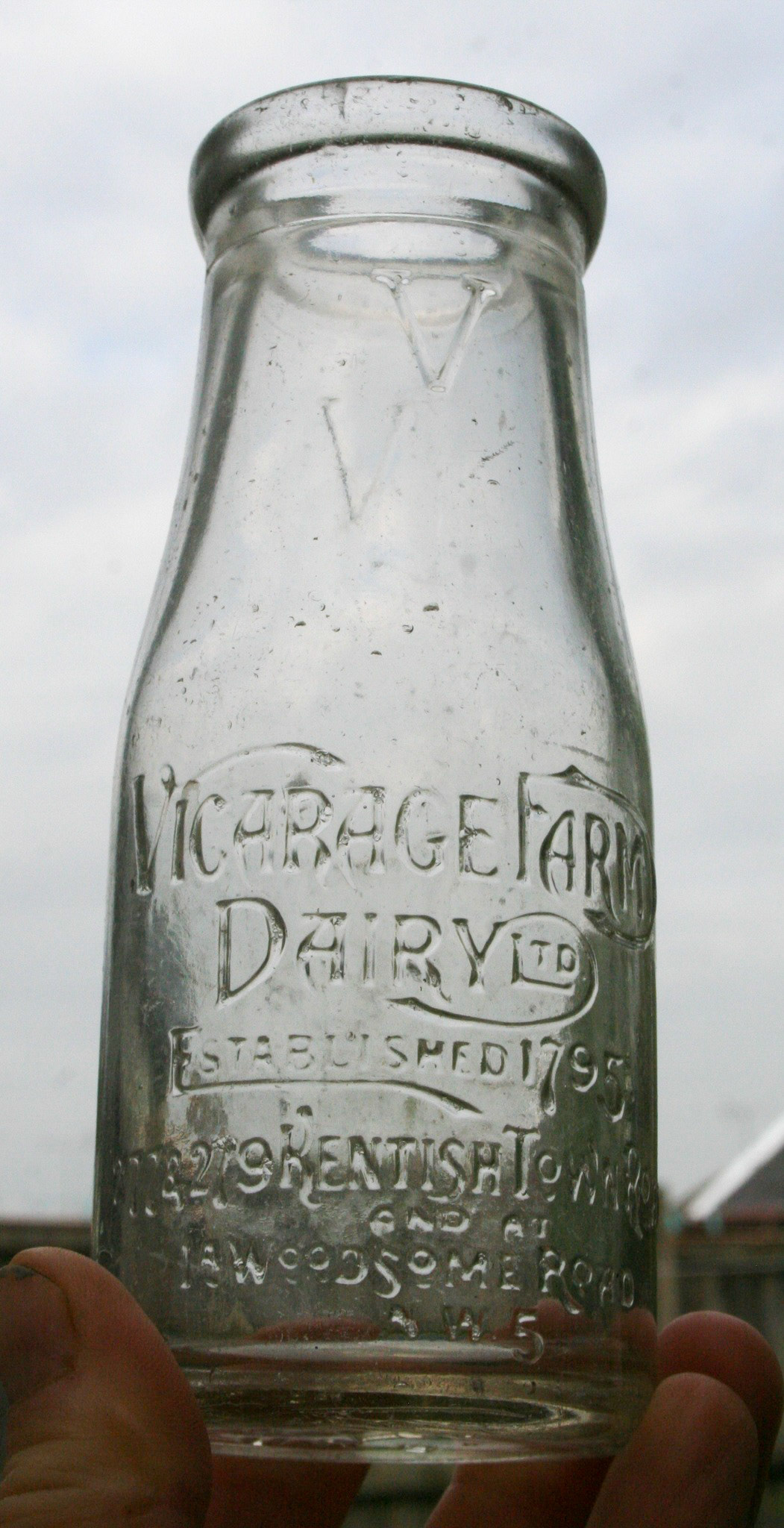 1920's Half-pint wide neck milk bottle from 'Vicarage Farm Dairy'. Mark Hudson comments "This was a reasonably sized dairy as a few of their bottles have been found over the years. There is reference to a site called Dairy Mews off Kentish Town Road in Camden, NW5 which was a former 'Express Dairy' milk depot, and before that 'Vicarage Farm Dairy' established in 1795. (Courtesy Milkmark Mark Hudson)