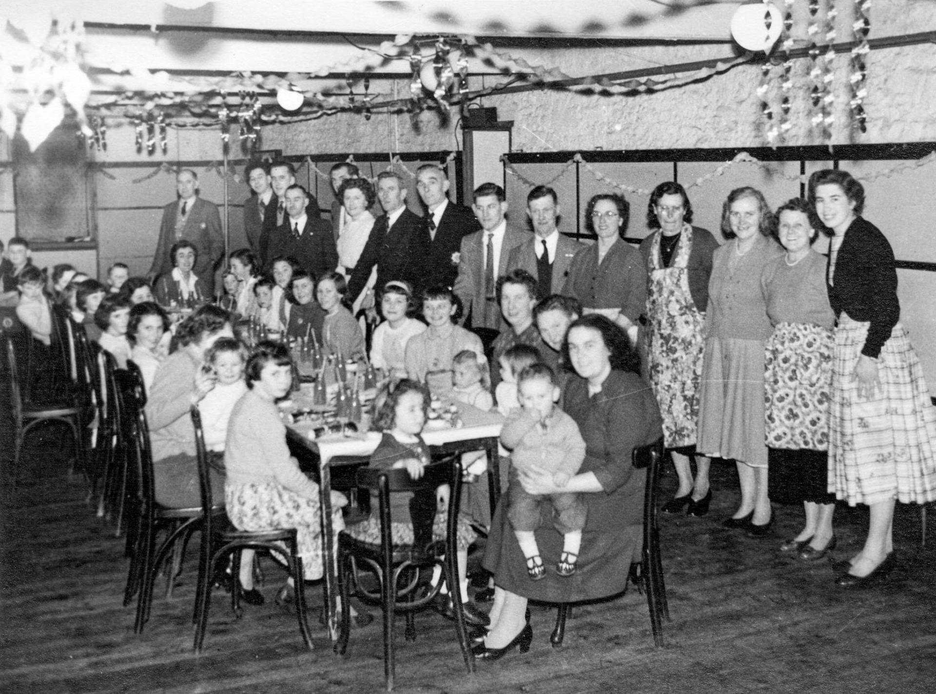 1958 Express Dairy, Frome, Christmas Party. James Parsons comments "My mother, with Christopher and Patsy nearest camera". Almost certainly taken at the old Welshmill Road site that was demolished in the 70's but had a real charm for those parties." (Courtesy James Parsons)