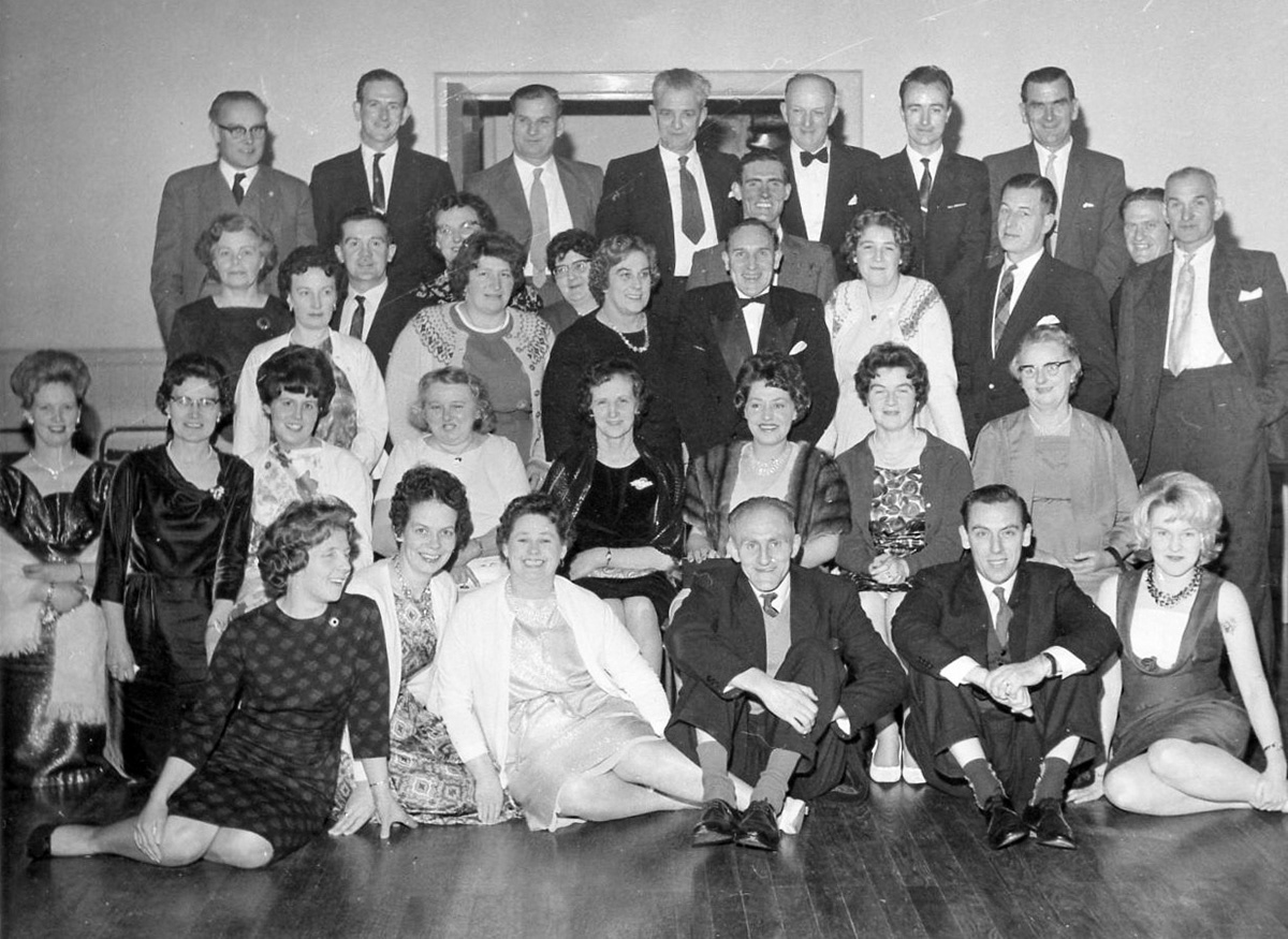 1965 Sanquhar Creamery Dance. Helen Page comments "That's my Dad top row, second from right, and my Mum wearing that fur stole!". Anne Tranter adds "Lovely to see Mum and Dad, middle row centre, Anne and Bill Miller". Helen Sommerville says "I see my Aunt Margaret Tonietti and her sister Mary on the front row." Charlie Nelson remembers "Love the pic, good photo of all but obviously my Mum and Dad are the standouts. Davie and Jean Nelson, also Mr and Mrs W Kinnear, Nesmay Sanderson (later to become my gaffer at the Co-op). But a very special mention to Mary Queens seated front row, three from the left, she introduced me to Buchanan's Treacle Toffee sweeties. She always had some on hand when I dropped into the Butter House on the pretence that I had to pass a message to my Dad. Happy days! 🤣🤣." John Southwell adds "Back row, first left-Cyril Evens who was the manager of the old Lockerbie creamery, with his wife in front." (Courtesy Helen Page)