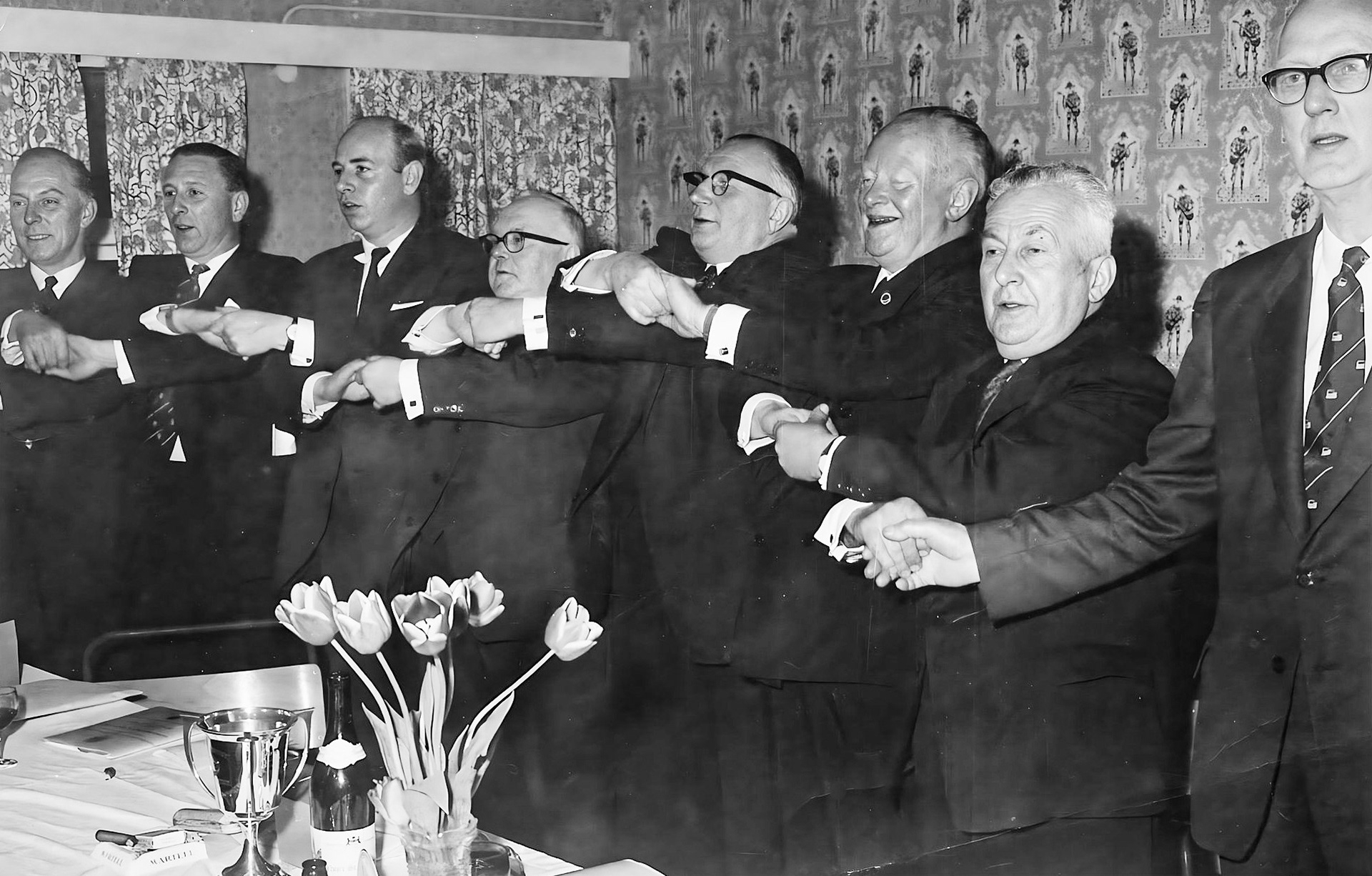 1950s Minsterley Creamery party. L-R ?, John Gurden, ?, Richard Preston, Arthur Gurden, Walter Nell (Express Chairman), Alan Warter, ? . Lynn Fickenscher's maternal grandfather Richard Preston worked at the creamery "Richard Edgar Preston was born in Birmingham in 1905. I believe he was employed at Wathes, Cattell &amp; Gurden Ltd Dairy in Birmingham in the early 1920s, and in 1927 he came to work at Minsterley. He rented a room at "Little Halston Farm" with the adoptive parents of his future wife, Maisie. He was initially employed as "Chief Clerk", in 1937 his title was "Secretary" of the newly formed "Minsterley Creameries" In 1961 he became "General Manager", then part of "Express Dairies", until his sudden death in March 1963." (Courtesy Lynn Fickenscher)