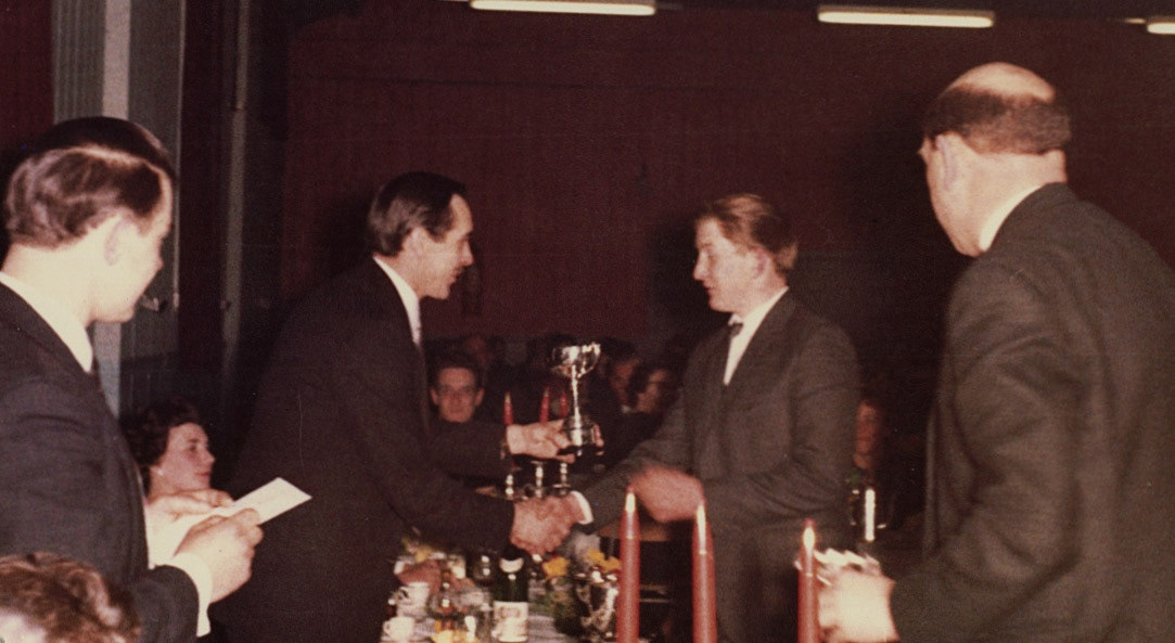 Keith Airey presenting to Jimmy Purslow.  Mike Challinor adds "Unless I am mistaken that is me MCing on the left, if so it was definitely a Social Club Do because I was Secretary for a couple of years. Possibly 67/68 time." June Pinches adds "I think that is the back of Jesse Rowson on the right." (Joe Lyons Collection)