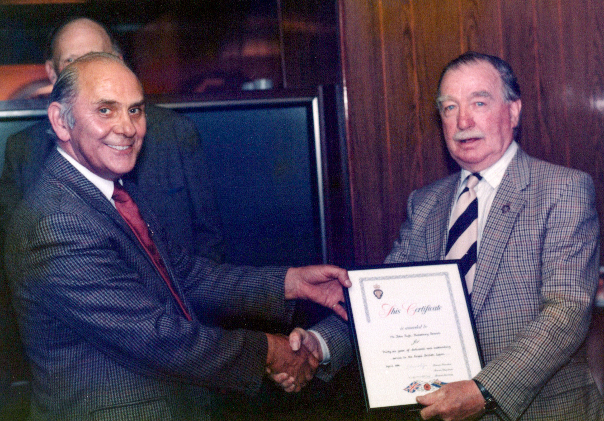 1980's Minsterley British Legion. Sandra Lewis identifies John Pugh from Pontesbury, he was Pontesbury Standard Bearer. With Major Burns. (Courtesy Joe Lyons)