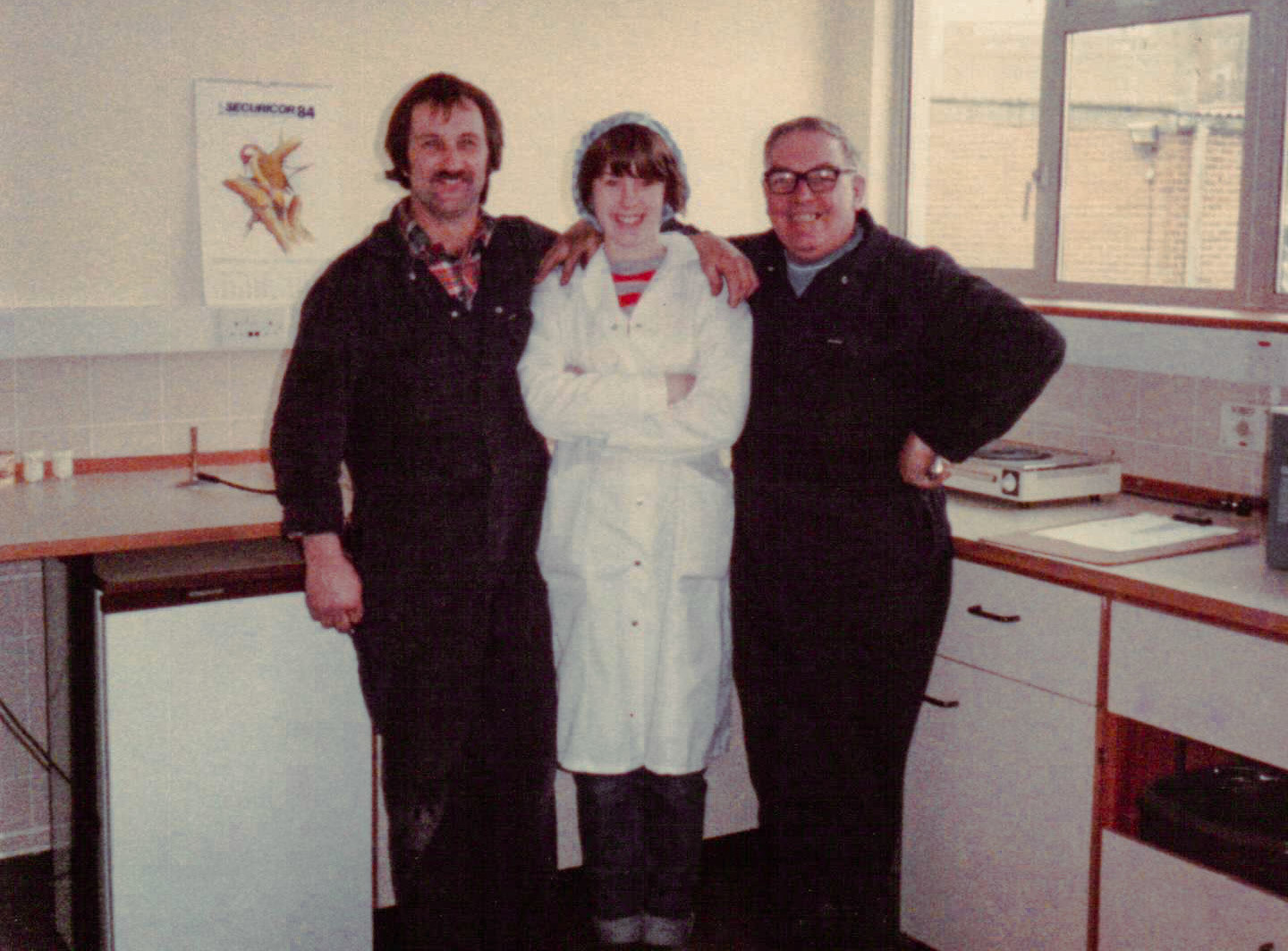 1984 Exeter Laboratory with Melvin Walrond, Wendy and Harry Wood. Jimmy Reid remembers Melvin "Bloody nice chap". Neil Wood comments "The two chaps in the overalls, the one with glasses is my Dad Harry (the hammer ) Wood.  Karen Walrond comments "It's my Dad, Melv Walrond" (Image courtesy Wendy Hawker)