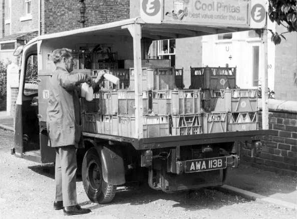 1960's? Express milkman and his 1964 Reg float AWA 113B "A milkman taking bottles from the crates on his float to deliver to someone's doorstep." Dave Fane comments "I think the AWA 113B float is from Express Northern."