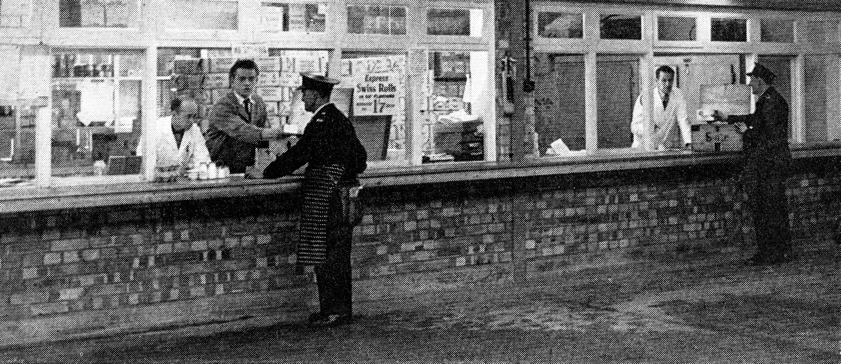1958 The new Northolt retail depot. "The servery has substantial floor space. Mr Charles Halford and Mr Ralph Ratcliffe check back their unsold produce." (Express News July)
