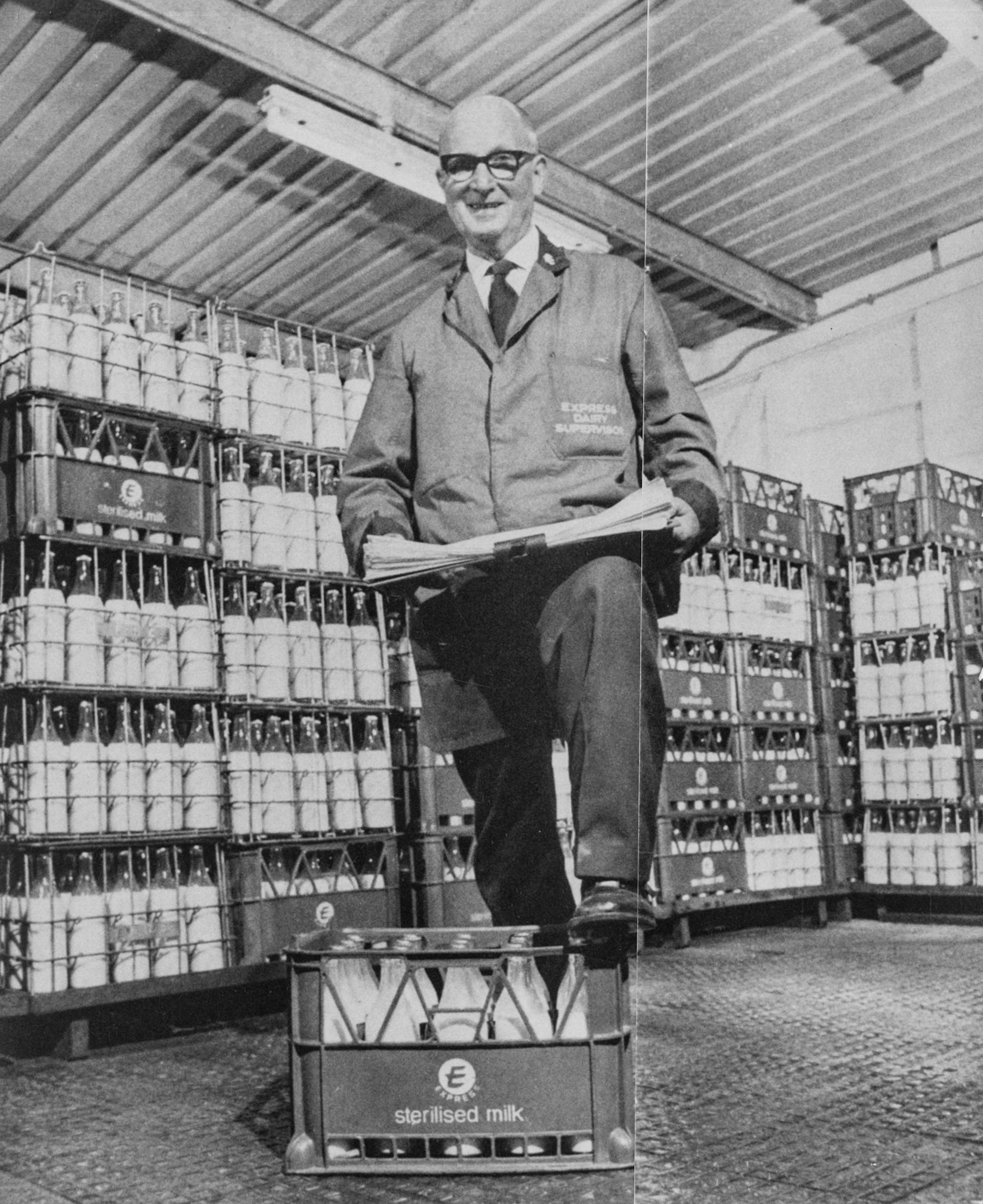 1973 Elisabeth Street, Manchester. Frank Ogden has chalked up 35 years, seen here in the sterilised milk store, it's his job as Administration Supervisor to keep an eagle eye on all depot activities. A dedicated cricket umpire, he is also Union Secretary of the Association of Clerical &amp; Technical Supervisory Staff. (Courtesy Paul Smith)
