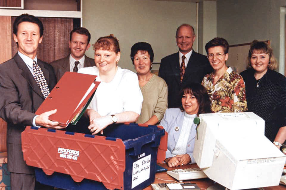 Tarvin. Office Staff packing up-Steve Ledsham, ?, Heather Dodd, Maureen Done, Peter Knight, Lyn Brunton (seated), Linda Lindop, Liz Weston. Sandra Booth comments "I remember the closing party at the community centre-that was a good night, but sad as you guys were such a good fun bunch!! I remember you played ‘Things can only get better’; it still always reminds me of that night! The tales George used to tell me I wonder how any work got done with all the pranks you played in each other!!! And of course I remember my lovely Dad Frank Pine, who worked there for many years x. (Courtesy Lyn Brunton, Old Tarvin FB Group)