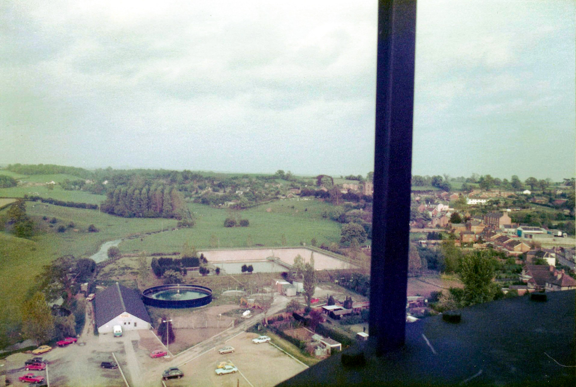 1986 Ruyton. Stephen Graves comments "I climbed inside the newly erected chimney before it was in service and took some panoramic shots from the top. The last picture shows a handrail upright-I'm sure that would have stopped me falling off! The pictures are overlooking the Cheese and Press Rooms and include the Builders Shop, Engineering Workshop, Stores and Effluent Plant. I worked in the Engineering department at the site from 1982-1993 when it closed. Great Times and Great People." (Courtesy Stephen Graves, Ruyton Revisited FB Group)