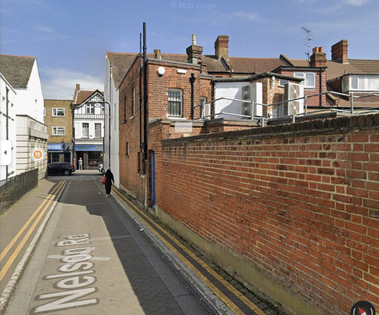 2025 Sidcup Depot location, Nelson Road. Robin Fraser Bell comments "The yard was at the end of the road, the old stable buildings gone now. All the rider prams were kept in the main building, with 3-wheelers and one 5-wheeler kept in the old stable block-you could still smell the horse urine really strongly in that building, many years after. The main depot stairs would lead up to the offices paying-in area, that where above the Express shop the stairs were blue until recently. My dad started there in 1955, until it moved to Welling depot in 1968, I helped him do most the rounds there as a boy, the Express shop in the High Street stayed open after the depot closed, and I went on to deliver goods to it as a yard boy about 1976, from Welling depot, parking my three-wheeler outside the shop. Taking the goods in I bumped into my old headmaster one day while doing this. Ginger Hodges went on to be servery man in his 60s at Welling Depot, when he came off the rounds he gave all his wet weather gear to my dad, it stayed in his garage all these years-he would never chuck it out, he would always say 'Ginger gave that to me'"