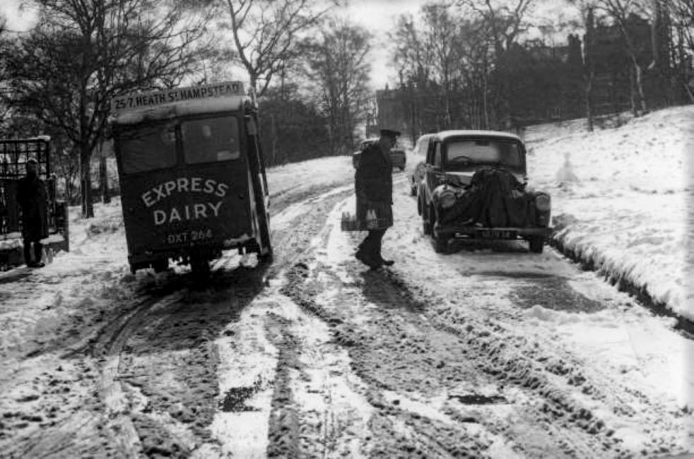1940's? Heath Street, Hampstead float delivering in the snow. Chris Purvis comments "Milkman never missed, no matter what the weather". (Courtesy Growing up in my Britain was GREAT FB Group)