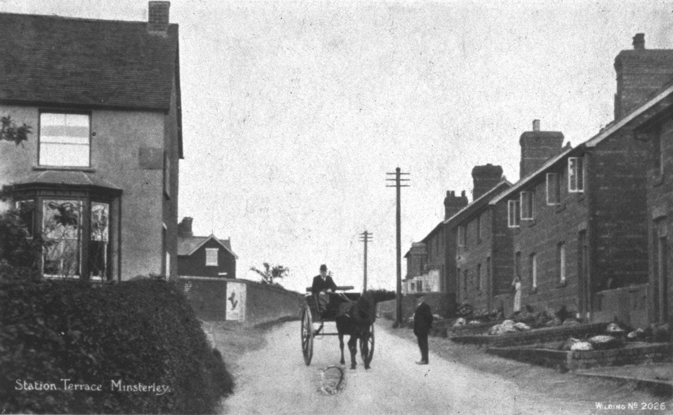 Minsterley Village. Mike Challinor comments "The shop on the left was situated at the bottom gate into the Creamery yard. I think it was owned by the Savage family and just went by the name 'Savages'”. Liz Matthews adds "I can remember buying a pair of brown jelly shoes from there!!!" (Joe Lyons 35mm slides)