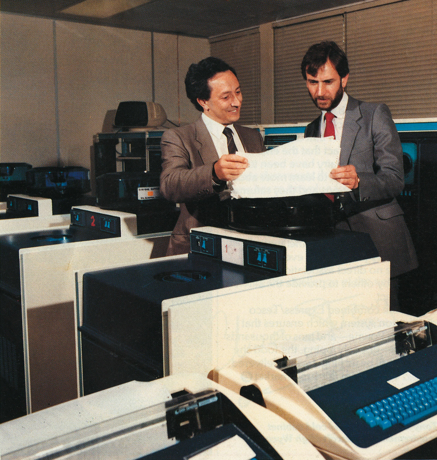 1984 Colin Warwick and Mike Morrow (Operations Manager) discuss a printout at South Ruislip computer centre.