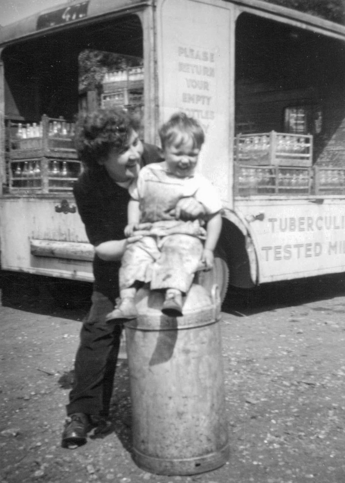 1940's-Early 1950's "Peter McLouglin sitting on a milk churn with Madge McLouglin". (Courtesy George Nixon and Peter McLoughlin, Levenshulme History Then & Now)