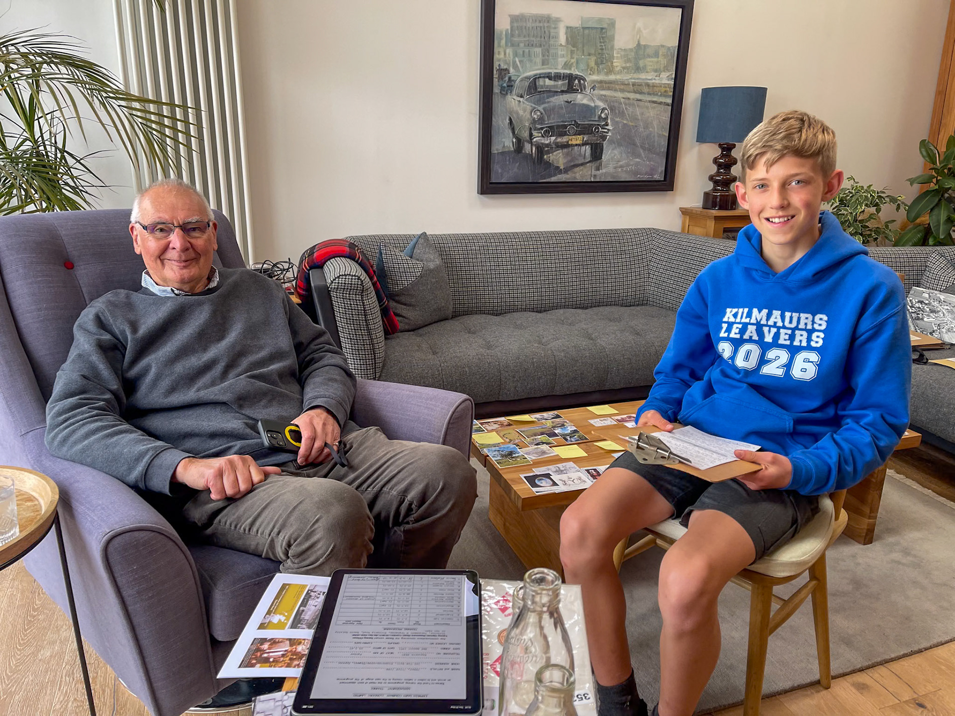 2026, May. Reviewing Kilmaurs Creamery photos and items of interest-Peter Roper with Fraser Edgar who is researching a school history project. (Courtesy of Fiona Edgar)