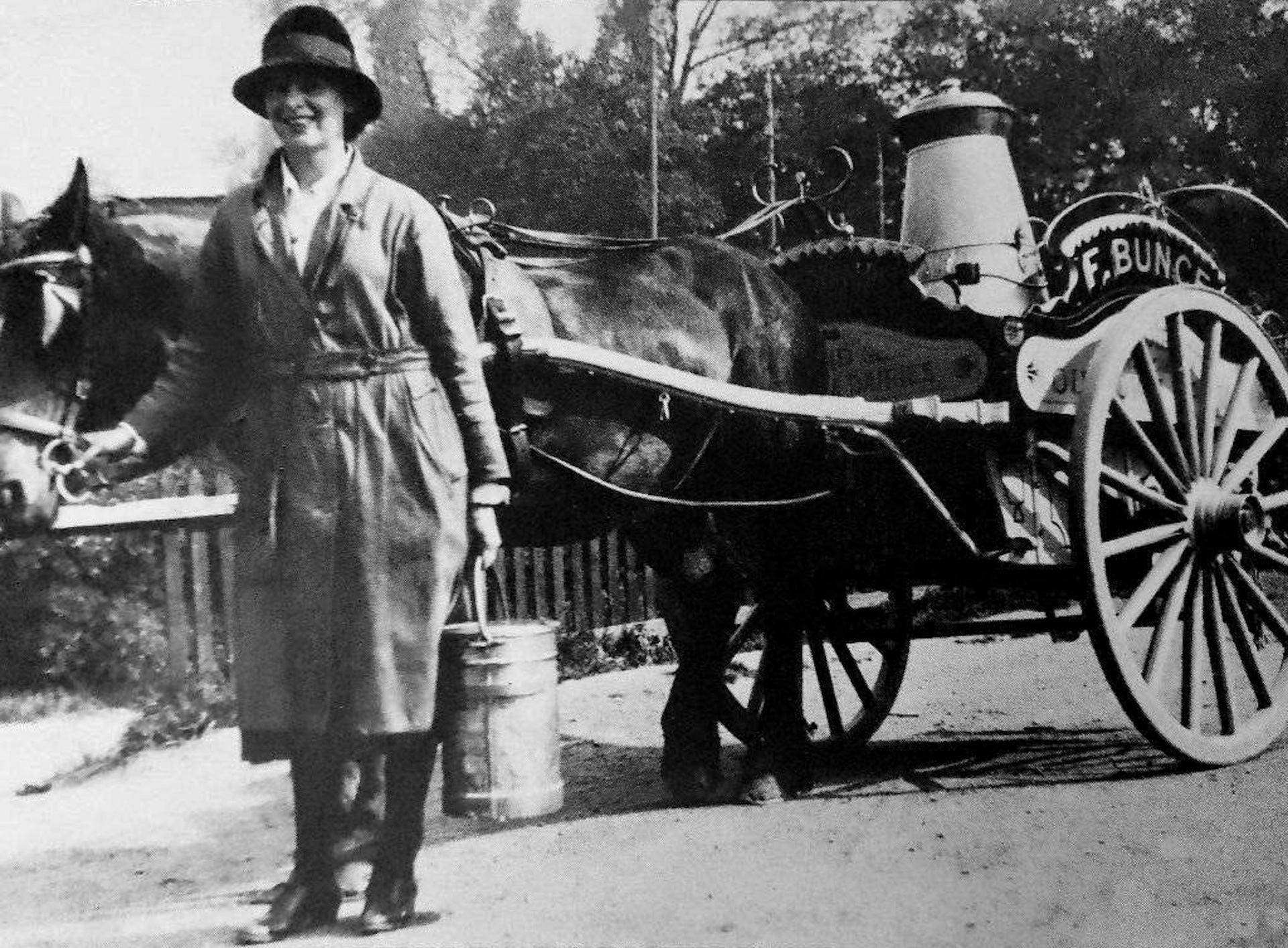 1920's? Hilda Bunce delivering milk in Hillingdon Village for her father Frederick (1871-1937) before the introduction of bottles. Fred's cows walked daily from fields in Royal Lane to his dairy on Hillingdon Hill. His sons kept the business going until 1957, when they sold out to the Express Dairy Co. (Courtesy Mick Cody)