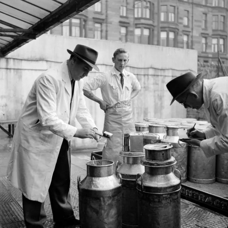 1953 Checking milk churns at a dairy in Glasgow. (Courtesy Picture Post-6754 'Glasgow: How A City Is Run')