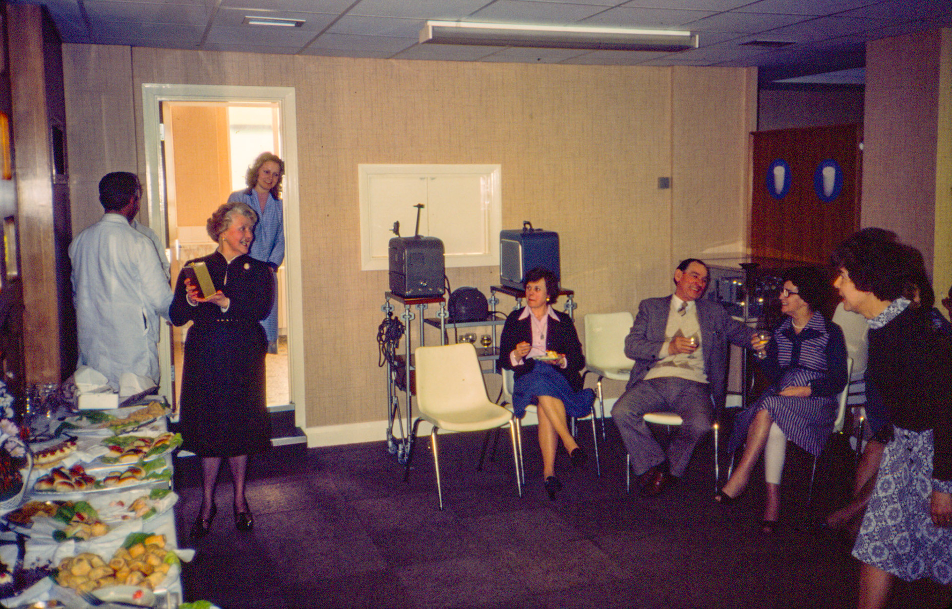 1981 South Morden visitors room. Retirement party for our receptionist/ switchboard operator Joan Wilkinson. L-R ?, ?. Jackie Bethell, 'Mac' Sennett, Vi Penford, Beryl Jones