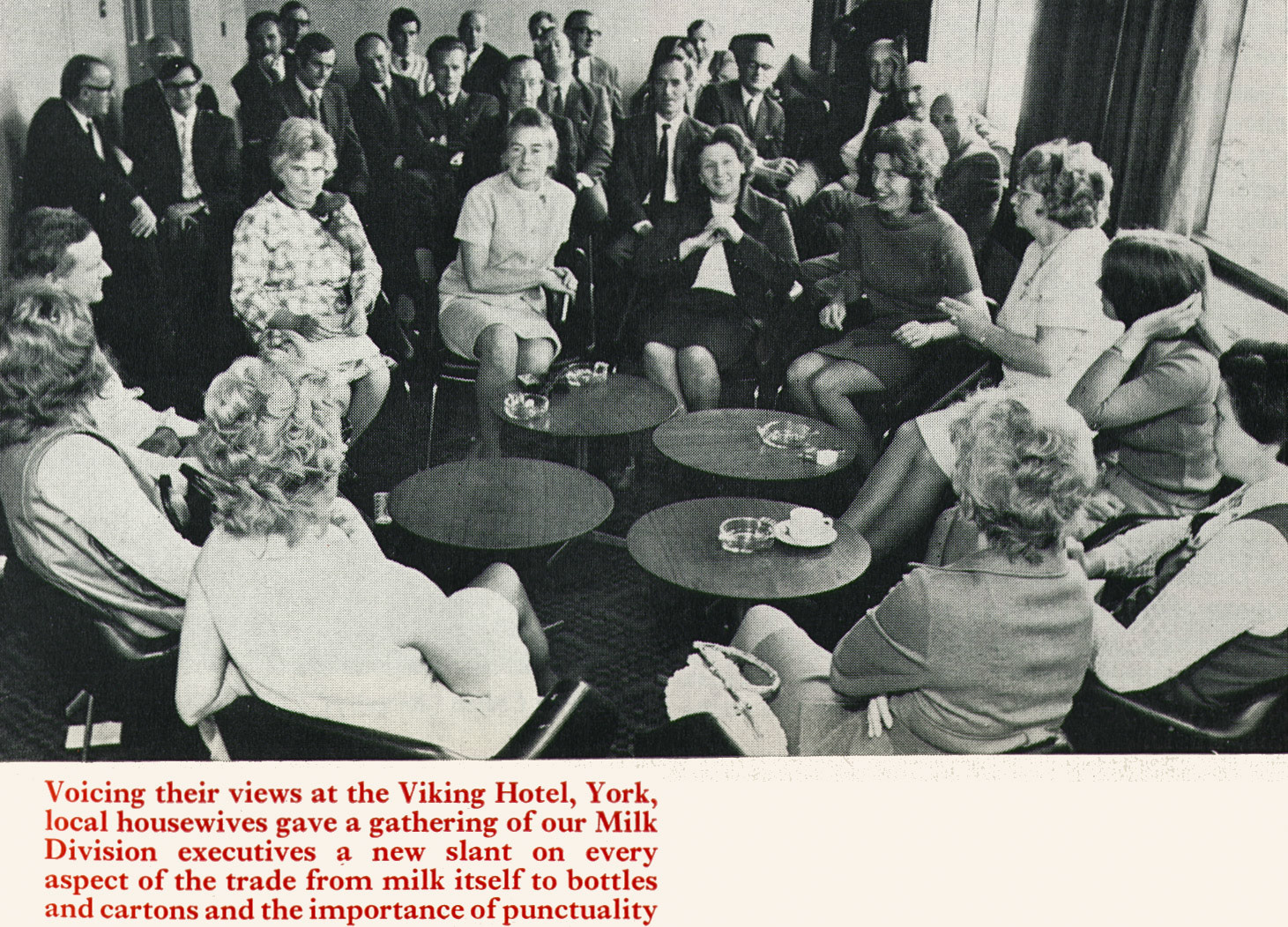 1971 Milk Division executives look on as a panel of housewives give their opinions. (Express News Christmas)