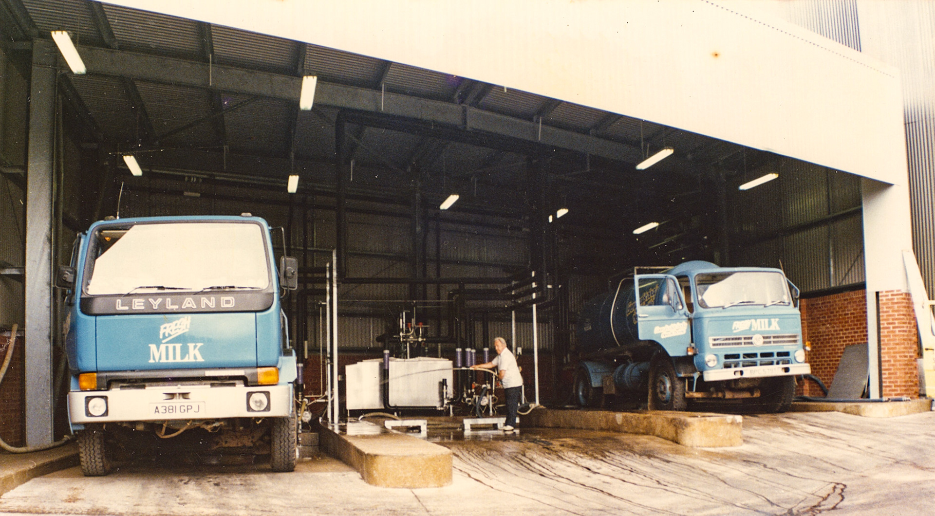 1983 Exeter Processing-milk reception with MMB Tanker A381 GPJ . Debbie Ridgway comments "That’s my dad Gordon Tootell 'Toots' on milk reception, he worked opposite shifts to Jonno back in the day❤️". Ian Johnston "Miss him every day … lovely man full of fun &amp; loved a joke ". (Pictures by Syd Johnston, presented by his son Ian via Teresa Heal)