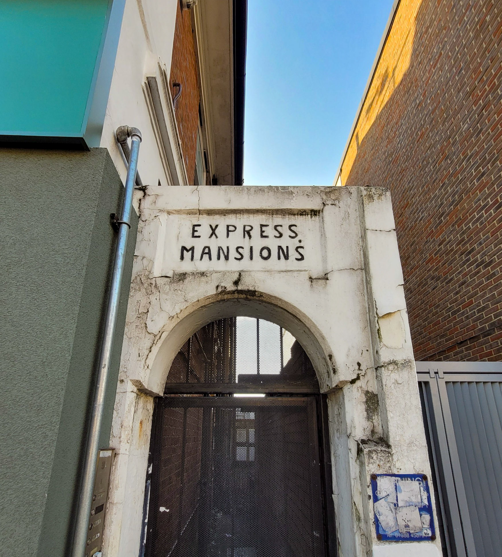 2025 Edgware Shop parade entrance to Express Mansions. Mark comments "Be aware, this building is going to be demolished in the near future, as part of Ballymore's Edgware Town Centre redevelopment." (Courtesy Mark Amies)