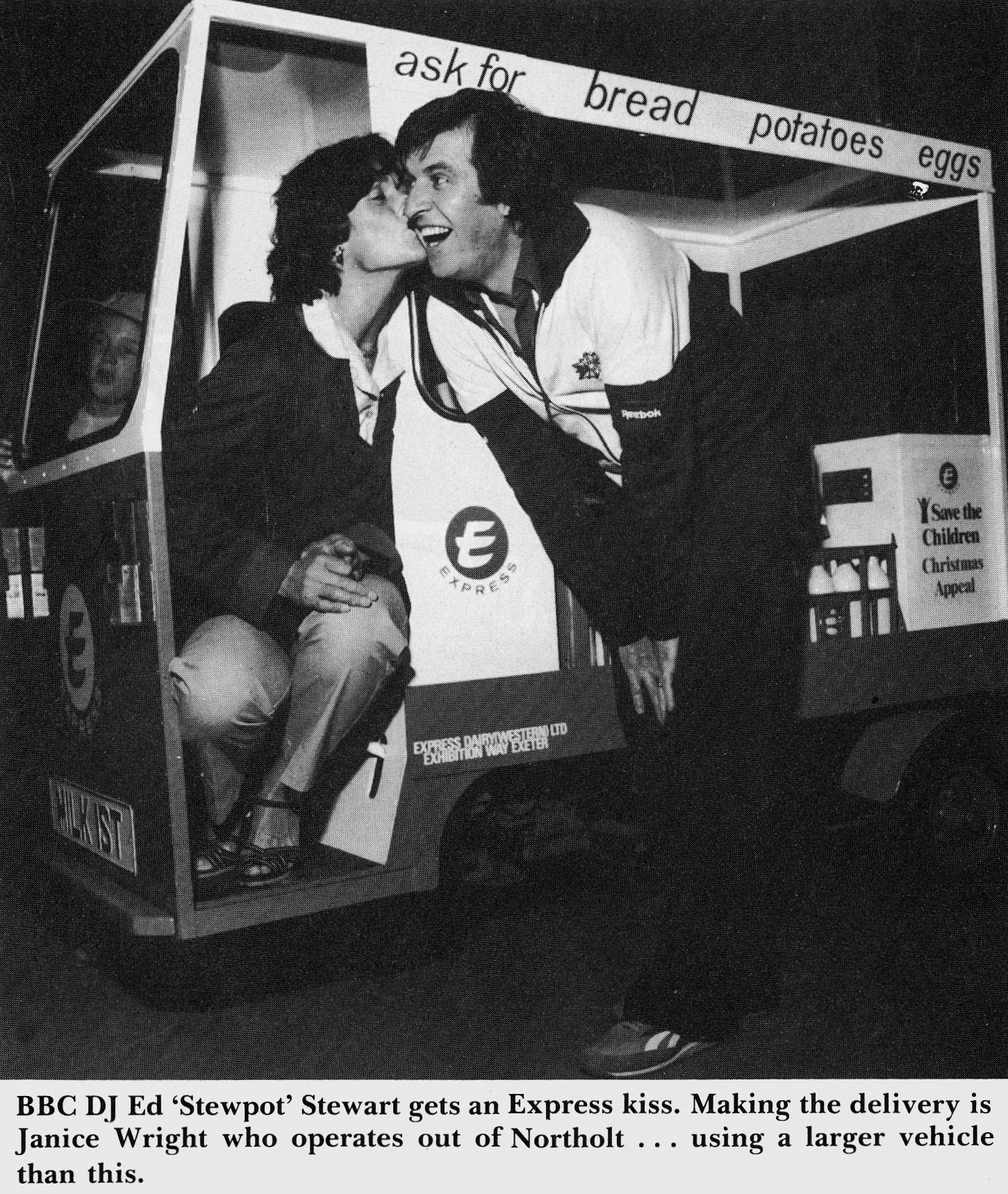 1981 BBC DJ Ed Stewart receives a kiss from Janice Wright of Northolt Depot.  (January Express News)