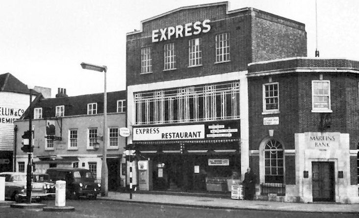 1964 Eltham Express shop with processing dairy behind. (Courtesy www.dover-kent.com/2015-project/Greyhound-Eltham.html)