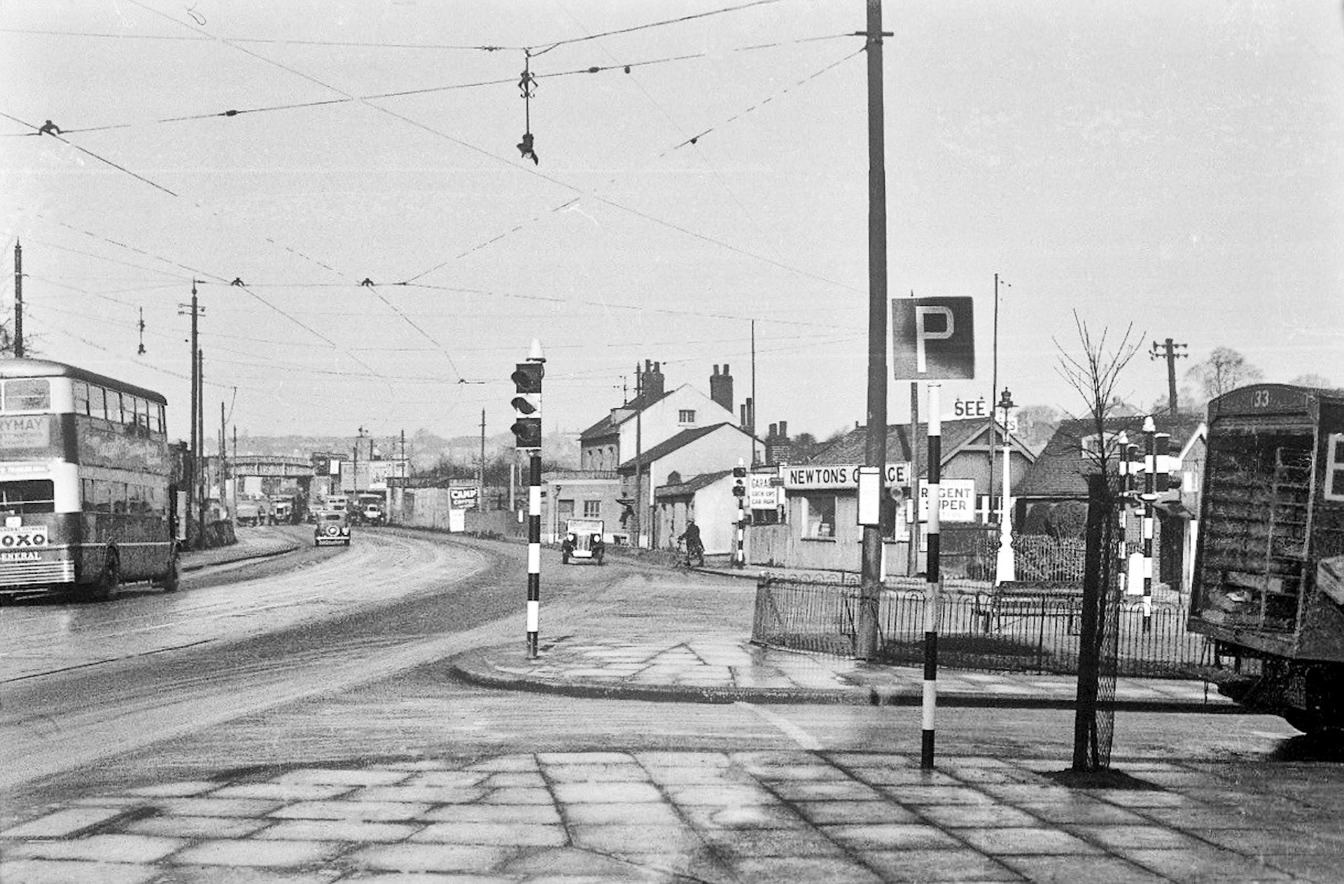 1940's? Barnet, top of Station Road, delivery to Express shop from where the photograph was taken. David Quy comments "... it’s the days of trams as there is only one wire (which the trams needed) as opposed to the trolleybuses that needed two wires." Paul Smith comments "My mum used to do relief cover there from her New Barnet shop (7 East Barnet Road) two miles down the road. It was hard work, there were only four ladies in my mum's shop to cover the whole week." Brian Wastell added "My aunt was Manageress there-Miss Minnie Oakley. You know those ladies worked really hard doing their jobs; Minnie used to travel by bus from Falldon way (near Henleys Corner) just to get to work-and paid their own fare." (Courtesy Paul Smith, photo posted by Terry Betty Levy, WHERE HAVE ALL THE BARNET PEOPLE GONE FB Group)