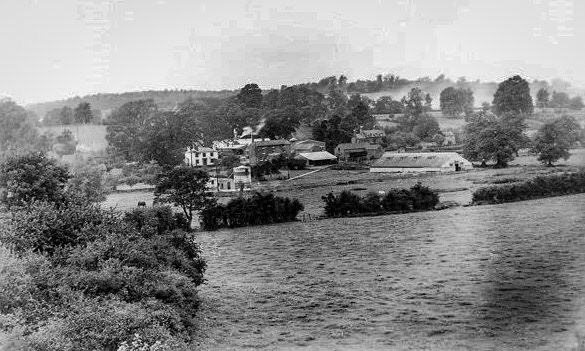 1938 view from Ruyton churchyard looking out over Doctor's Meadow, behind which stands the dairy.  The Ruyton Co-operative Dairy was formed by William Howell Gittins, of Hall Farm, in 1918. In 1936, Kraft Foods took over the dairy. (Courtesy John Guest, Ruyton Revisited FB Group)