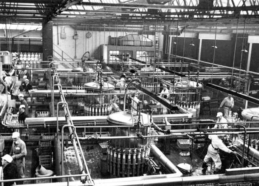 1962 Cricklewood "View at Express Dairy Company Ltd's bottling plant at Cricklewood of equipment supplied by Firth Vickers Stainless Steel Ltd (Staybrite Works). Philip Boyd comments "That was equipment when I started there. The old Alka fillers were slow compared to the UDEC when Cricklewood was upgraded, from 10 fillers to, I think it was 6." (Courtesy www.picturesheffield.com-u09082)
