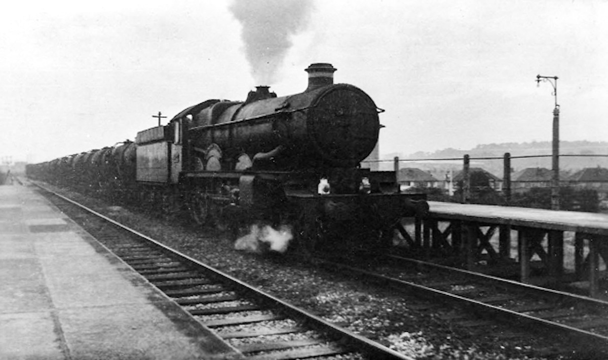 1958 Evening milk train at South Greenford Halt, hauled by 4077 Chepstow Castle. The tankers are returning from Kensington to the West Country empty. Michael Dembinski comments "Leaver Gardens is to the west of the line, photo taken from the 'Up' platform." Bill Dewdney adds "The milk train went through South Greenford Halt around 10pm nightly. If I wasn't home by then, I was in trouble!" (Courtesy Christopher Slatford)