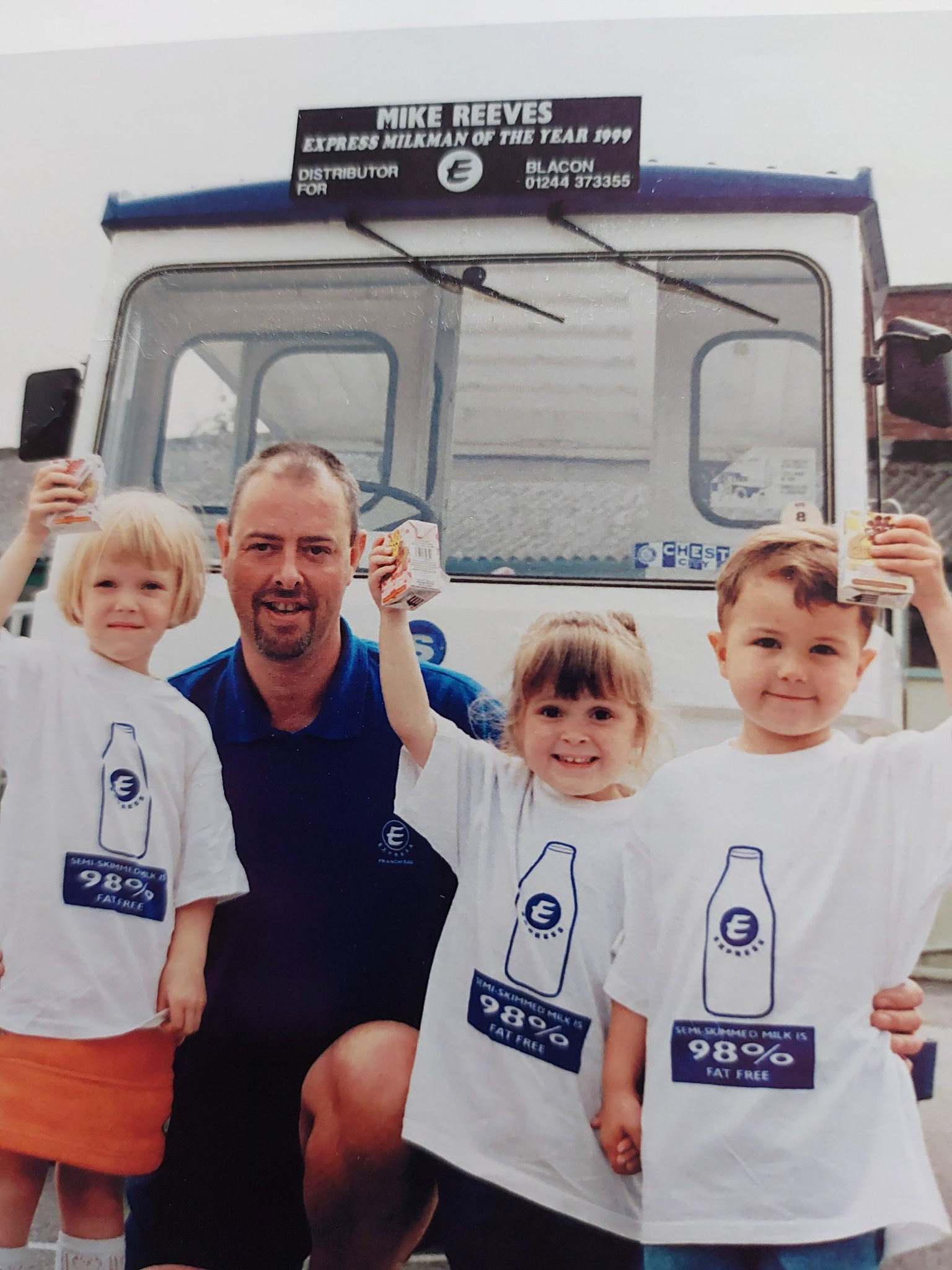 1999 Blacon-Mike Reeves celebrates being Express Milkman of the Year, along with kids from a local nursery that he used to serve. (Courtesy Mike Reeves)